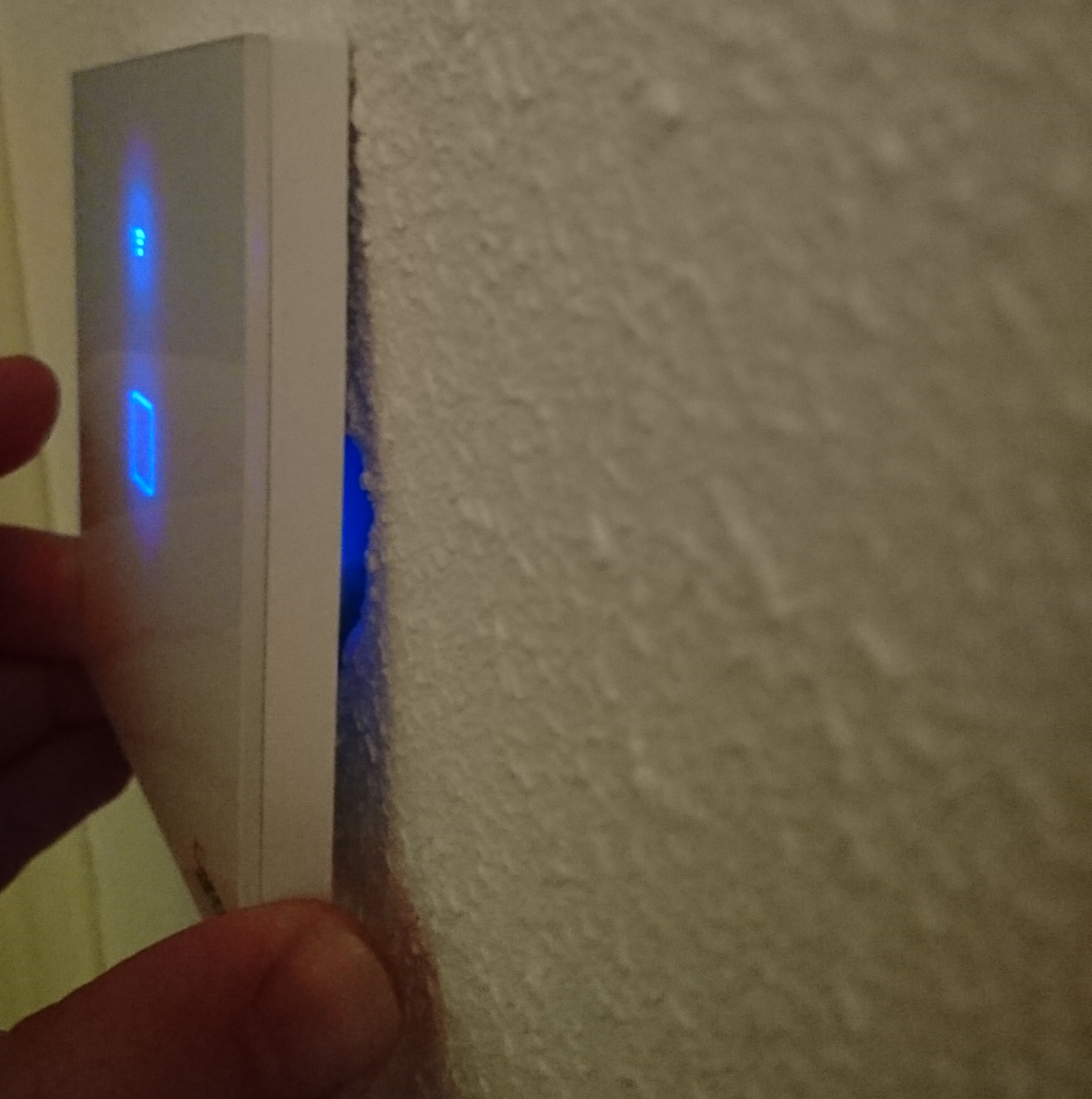 Photo showing how the Sonoff TX comes loose from the wall even more.